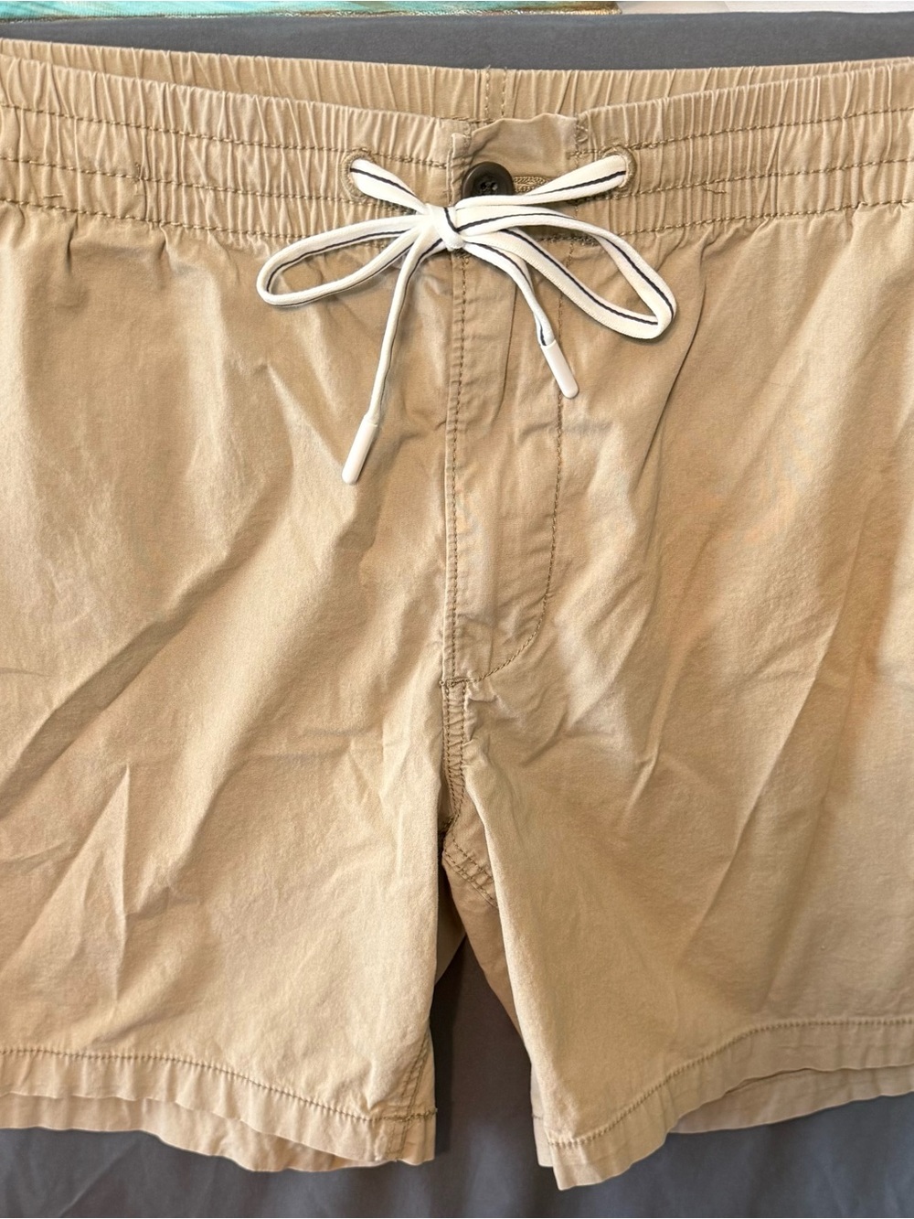 St. John's Bay Khaki shorts with button closure and drawstring.